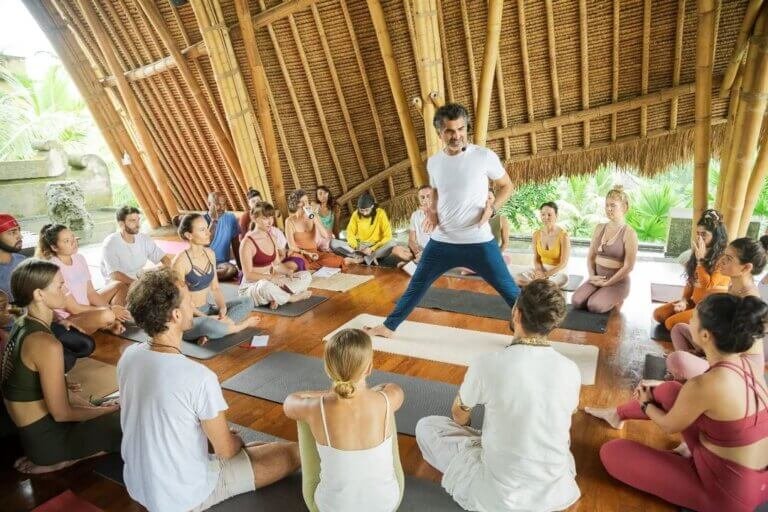 Yoga Instructor teaching students in Bali