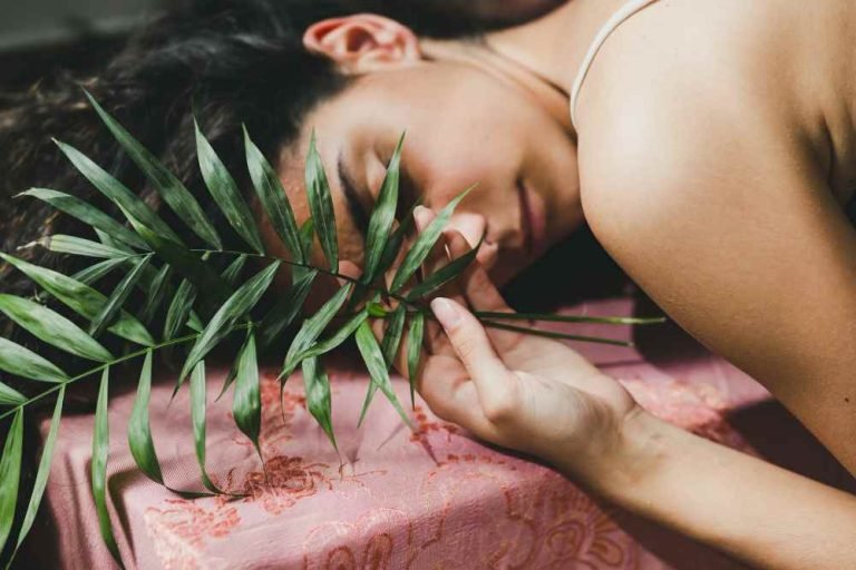 young-woman-with-leaves-sleeping_11zon