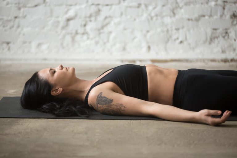 young-yogi-attractive-woman-savasana-pose-loft-background-c