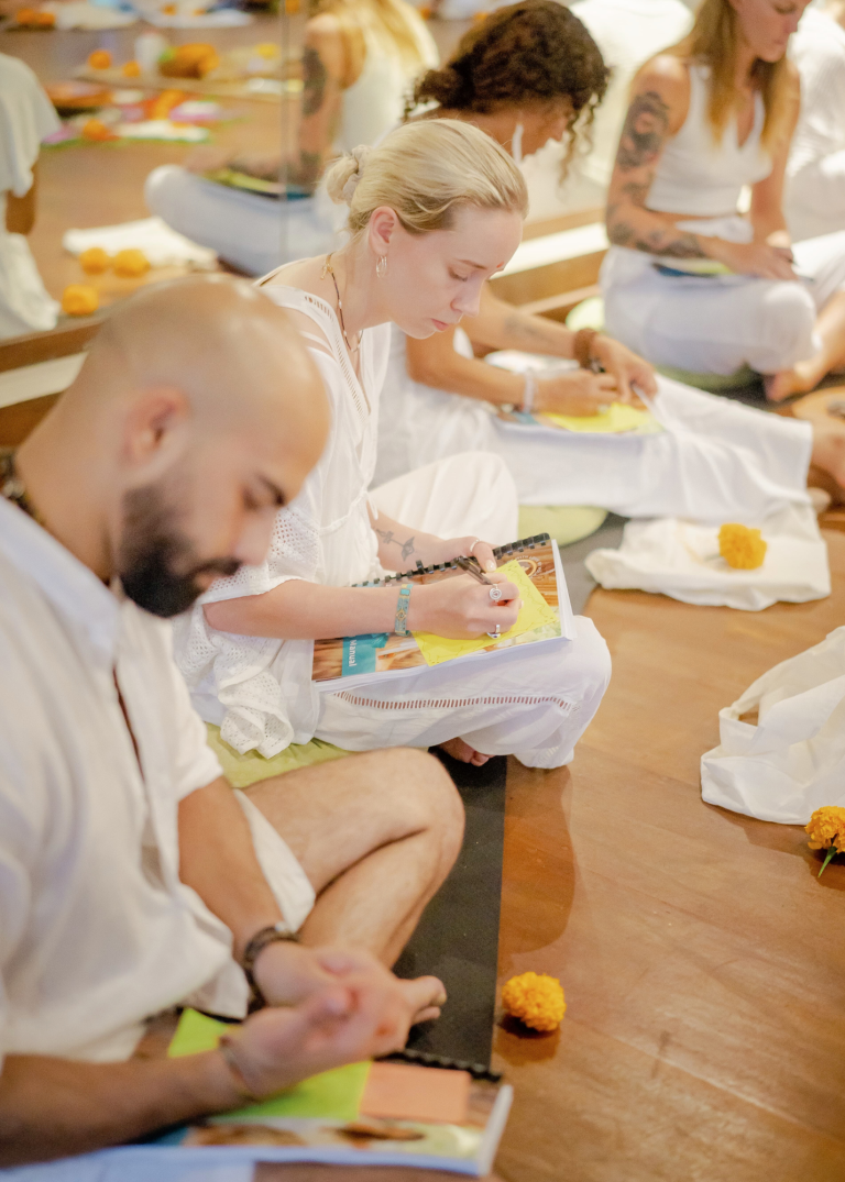 yoga students during meditation and philosophy class at authentic yoga teacher training Bali
