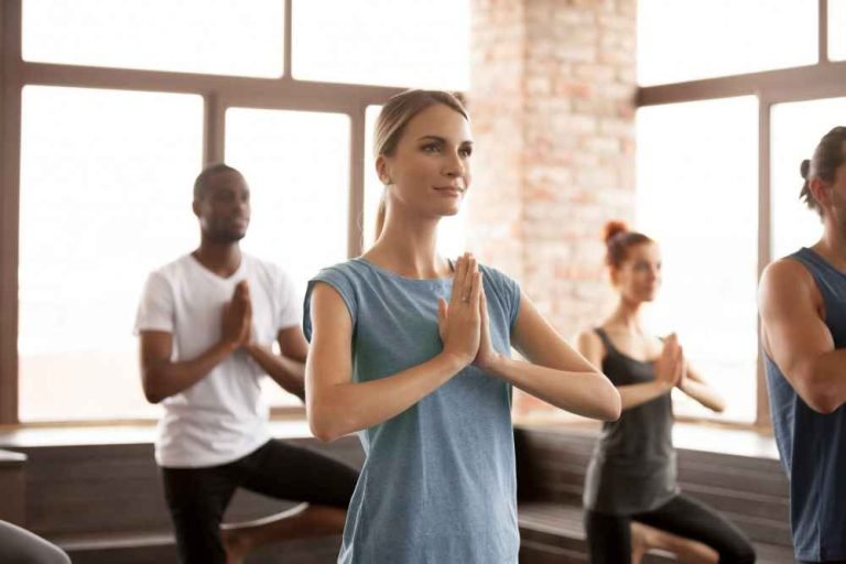 young-woman-group-sporty-people-tree-exercise_11zon