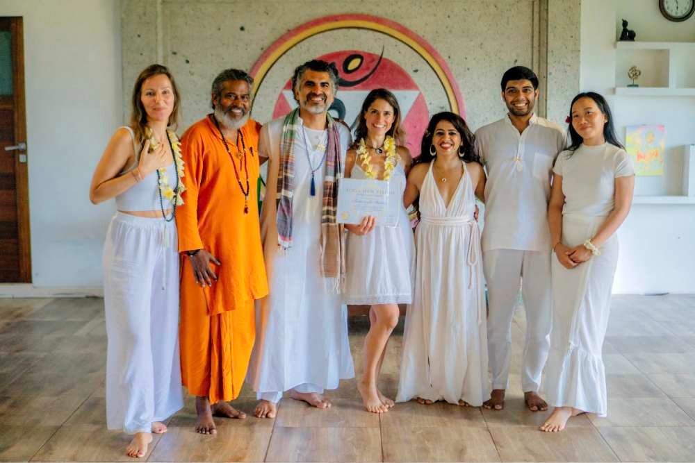 student receiving yoga teacher certificate