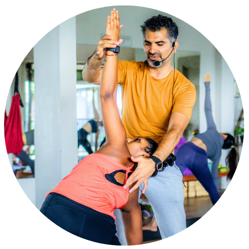 yoga instructor teaching alignment during teacher training in Bali