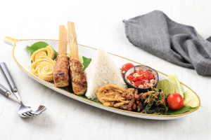 raditional Balinese nasi campur with rice and assorted side dishes in Ubud, Bali.