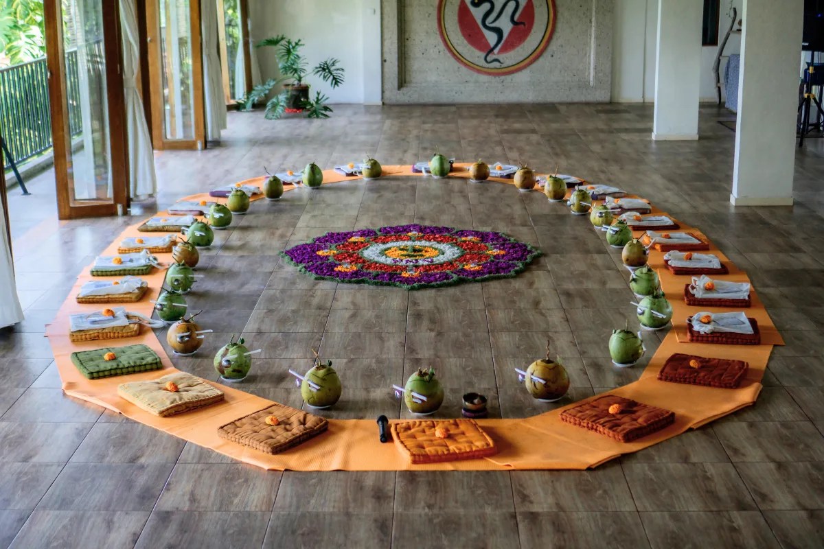 students creating flower mandala ceremony during 200-hour yoga teacher training in Bali