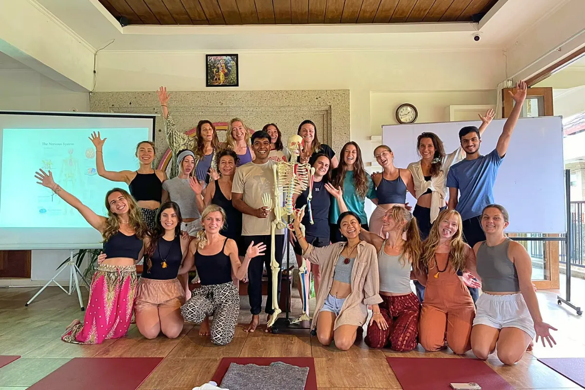 yoga anatomy class during 200-hour yoga teacher training in Bali studying body structure and physiology