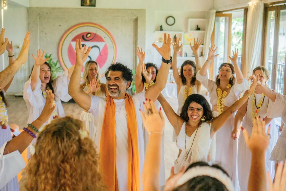 Yoga New Vision students celebrating together in the studio