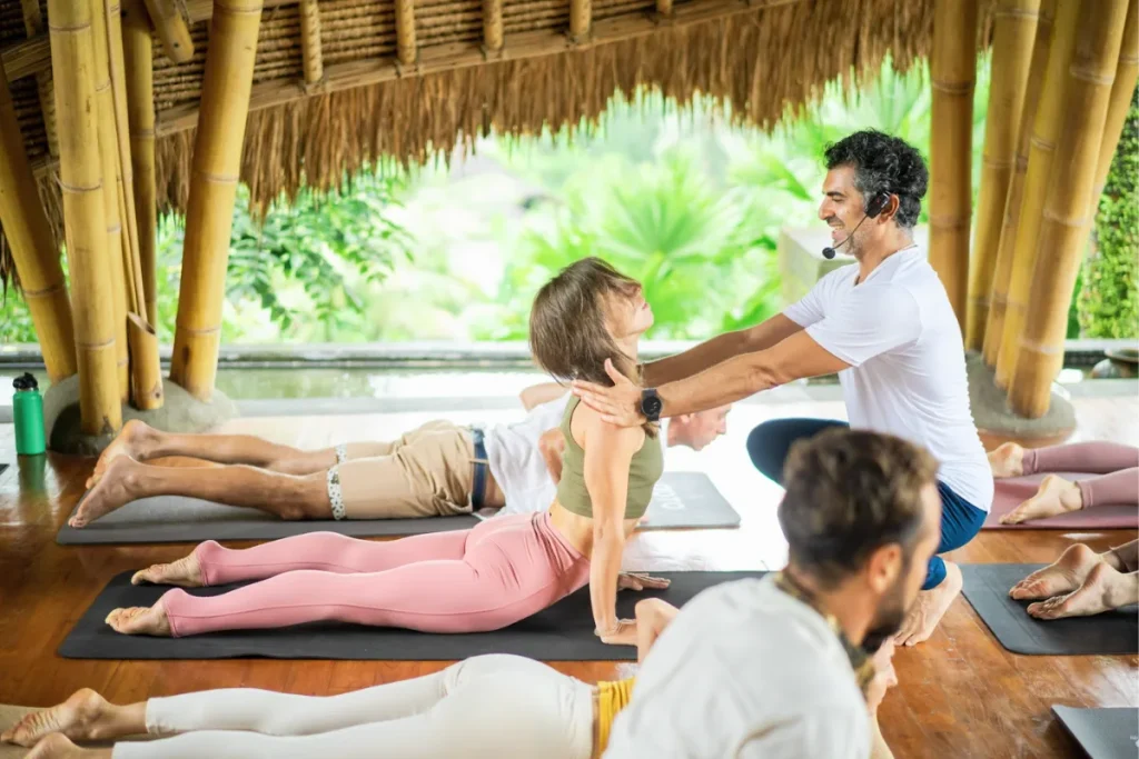 YNV Teacher Adjusting Cobra Pose in Class