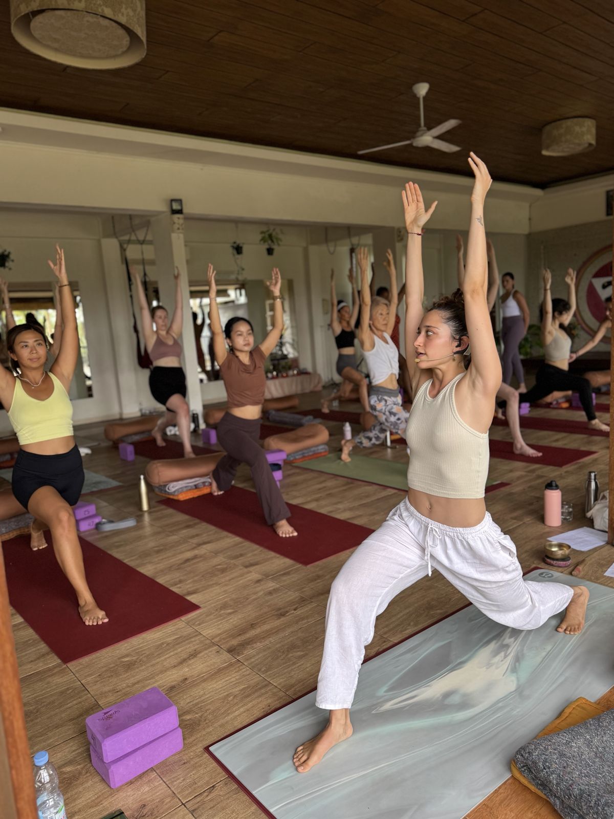 Student learning to teach with presence and confidence during yoga teacher training in Bali